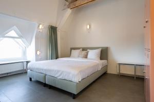 Letto o letti in una camera di Pink Flamingo Boutique Hostel
