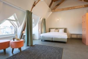 Letto o letti in una camera di Pink Flamingo Boutique Hostel