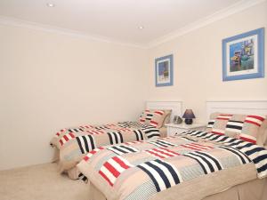 Katil atau katil-katil dalam bilik di Bay Parklands 32 fantastic unit with air conditioning pool tennis court and spa +16 gambar
