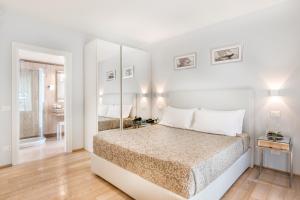 Postel nebo postele na pokoji v ubytování Hotel Stella Della Versilia
