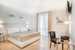 Postel nebo postele na pokoji v ubytování Hotel Stella Della Versilia
