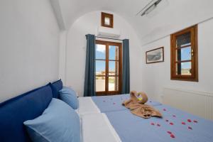 A bed or beds in a room at Private Villa Evgenia with swimming pool