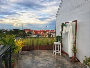 a white dress hanging on the side of a building at DAAD FAH home and cafe in Phetchaburi