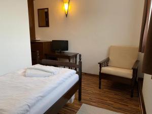 TV a/nebo společenská místnost v ubytování Motel M