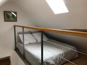 a bunk bed in a room with a skylight at Taboo Treigny in Treigny