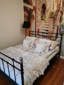 Cama o camas de una habitación en Apartamenty Apartlux