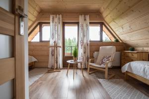 Posteľ alebo postele v izbe v ubytovaní Domek Odlotowy Zakatek