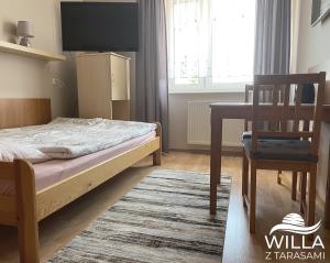 Postel nebo postele na pokoji v ubytování Willa z Tarasami