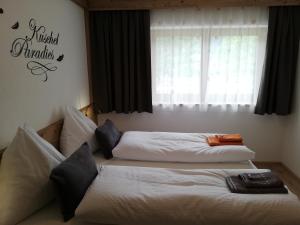 A bed or beds in a room at Appartements Spitaler