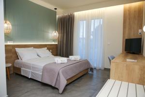 מיטה או מיטות בחדר ב-Verano Apartments