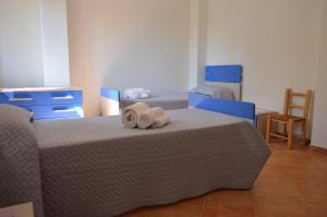 Postel nebo postele na pokoji v ubytování Casa Nonno Gino 2