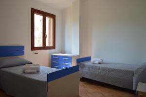 Postel nebo postele na pokoji v ubytování Casa Nonno Gino 2