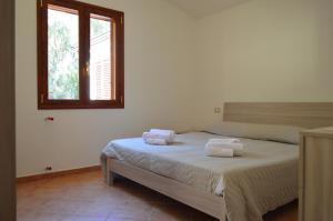 Postel nebo postele na pokoji v ubytování Casa Nonno Gino 2