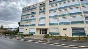 an office building on the side of a street at Lyloo Studio Epernay in Épernay