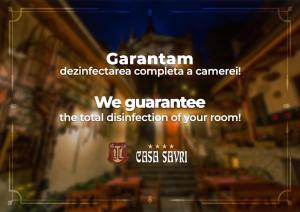 a sign that says canadian defeatanca complete a campaign we guarantee the total at Casa Savri in Sighişoara