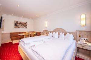 Posteľ alebo postele v izbe v ubytovaní Hotel Serles