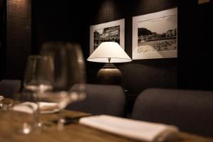 a lamp sitting on a table in a restaurant at Zenit Convento San Martin in Donostia-San Sebastián