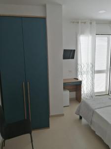 Un pat sau paturi într-o cameră la Hotel Tirreno Formia