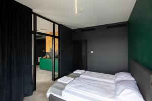 Posteľ alebo postele v izbe v ubytovaní TOP Garden Aparthotel