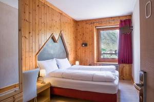 Posteľ alebo postele v izbe v ubytovaní Hotel Bernina