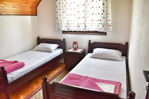 מיטה או מיטות בחדר ב-Holiday Home Amzici