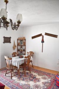 a dining room with a table and chairs at Holiday Home Amzici in Amzići