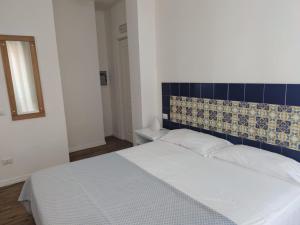 Postel nebo postele na pokoji v ubytování Residenza Punta Stendardo