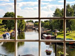 a view of a river from a window at Riverside Inn in Ely
