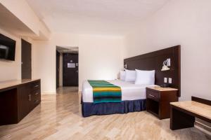 Cama o camas de una habitación en Crown Paradise Club Cancun - All Inclusive