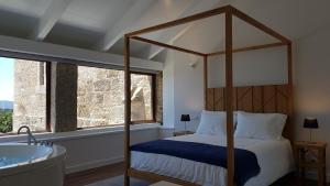Ένα ή περισσότερα κρεβάτια σε δωμάτιο στο Casas do Monte de Roques +17 φωτογραφίες