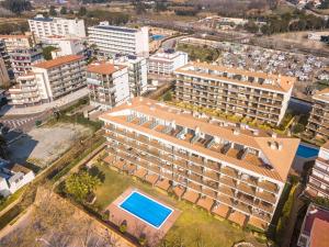 an aerial view of a building with a swimming pool at MILLENIUM 1 2-2 in Roses