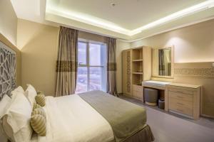 Lova arba lovos apgyvendinimo įstaigoje Ewaa Express Hotel - Al Hamra
