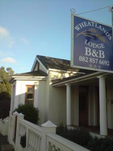 a building with a sign that reads motel bbb at Wheatlands Lodge in Bredasdorp