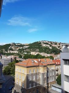 a building with a view of a city at Soba Marinko in Rijeka