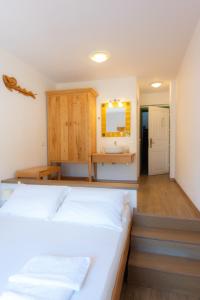A bed or beds in a room at Margado