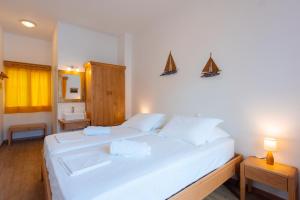 A bed or beds in a room at Margado