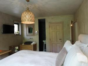 Postel nebo postele na pokoji v ubytování Wellness Sweet Bonihu B&B