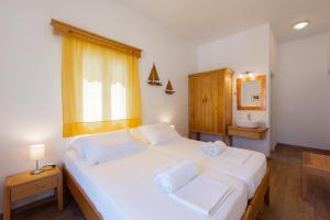A bed or beds in a room at Margado