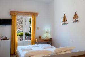 A bed or beds in a room at Margado