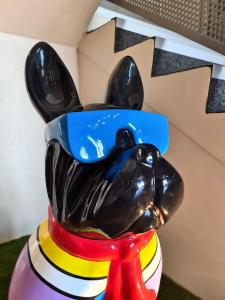 a statue of a dog on top of a table at The Originals City Hôtel Marseille Aéroport in Vitrolles