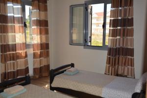 Postel nebo postele na pokoji v ubytování Lotus Sea View Apartments