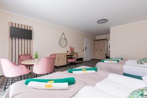 Postel nebo postele na pokoji v ubytování Flamingo