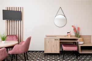 TV a/nebo společenská místnost v ubytování Flamingo