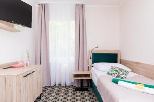Postel nebo postele na pokoji v ubytování Flamingo