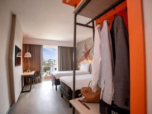 Ένα ή περισσότερα κρεβάτια σε δωμάτιο στο ibis Styles Lima Benavides Miraflores