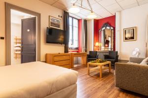 Postel nebo postele na pokoji v ubytování Hôtel des Bains