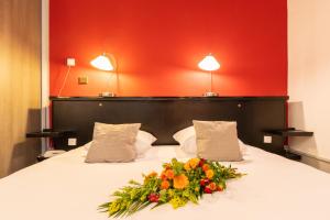 Postel nebo postele na pokoji v ubytování Hôtel des Bains