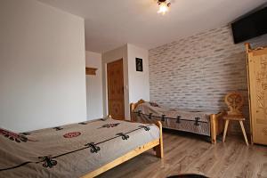 Cama o camas de una habitación en Pokoje Bukowskich