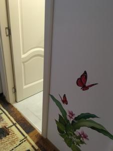 a door with butterflies on it next to a doorway at House Centrul Istoric ll in Sibiu
