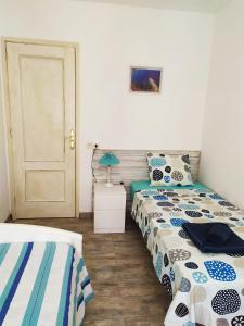 Postel nebo postele na pokoji v ubytování Apartments Tazacorte Beach 2-3 floor